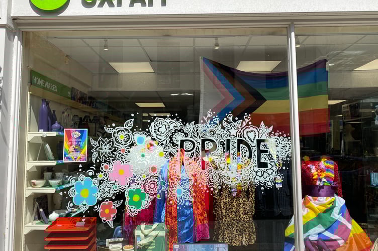 Tavi Pride Oxfam front window.