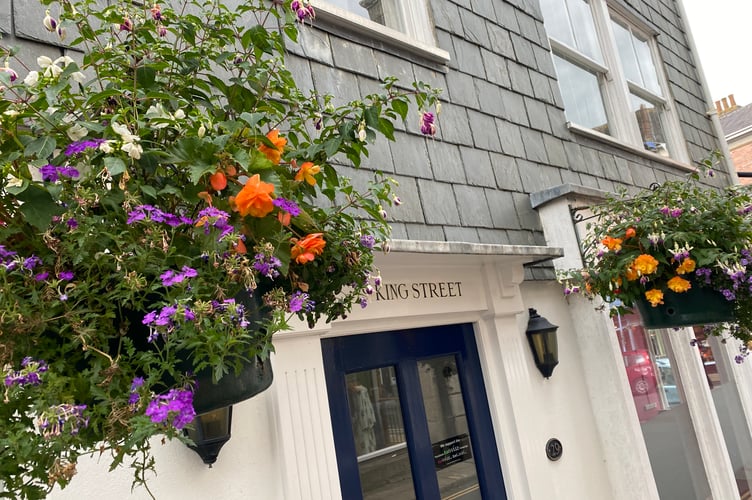 A King Street office's hanging baskets.