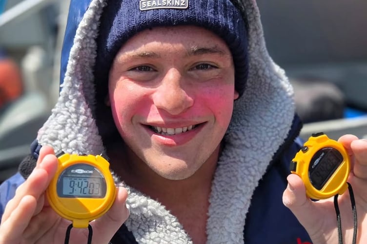 Mount Kelly College student Barnaby proudly showing his cross-Channel swim time.