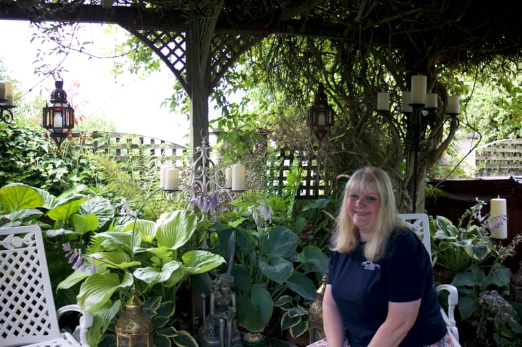 Claire White is rightly proud of her and husband Mark's admired floral home in Lamerton which is equally pretty in the back garden. Picture by Jude Wright.