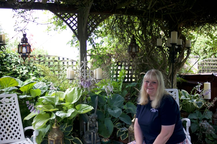 Claire White is rightly proud of her and husband Mark's admired floral home in Lamerton which is equally pretty in the back garden. Picture by Jude Wright.