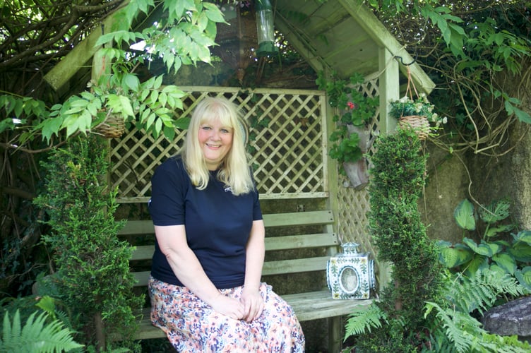 Claire White and her husband Mark have created a 'home outdoors' as a garden with many parts in Lamerton (including this picturesque bench).. Picture by Jude Wright.