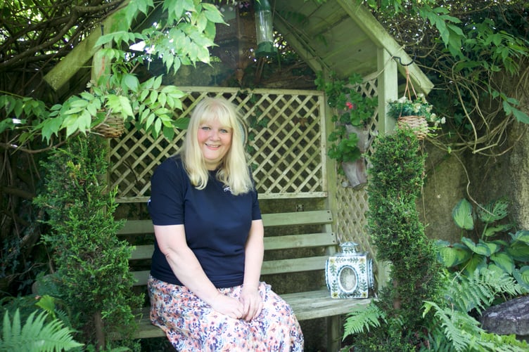 Claire White and her husband Mark have created a 'home outdoors' as a garden with many parts in Lamerton (including this picturesque bench).. Picture by Jude Wright.