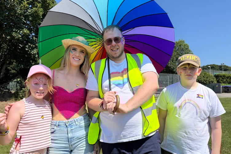 Okehampton Pride organiser Daniel Burgess with others enjoying the day.  AQ 6558
