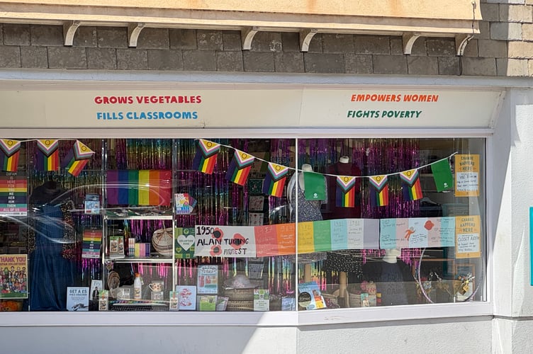 The Oxfam Shop window decorated for Okehampton Pride.  AQ 6469
