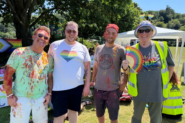 Colour cricket participants, left and third left, with Okehampton Pride organisers Daniel Burgess, second left and Jessica Greaves, right.  AQ 6559
