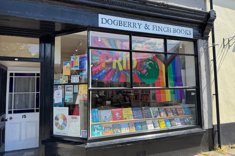 Pride flags on display at Dogberry and Finch Books for Okehampton Pride.  AQ 6462
