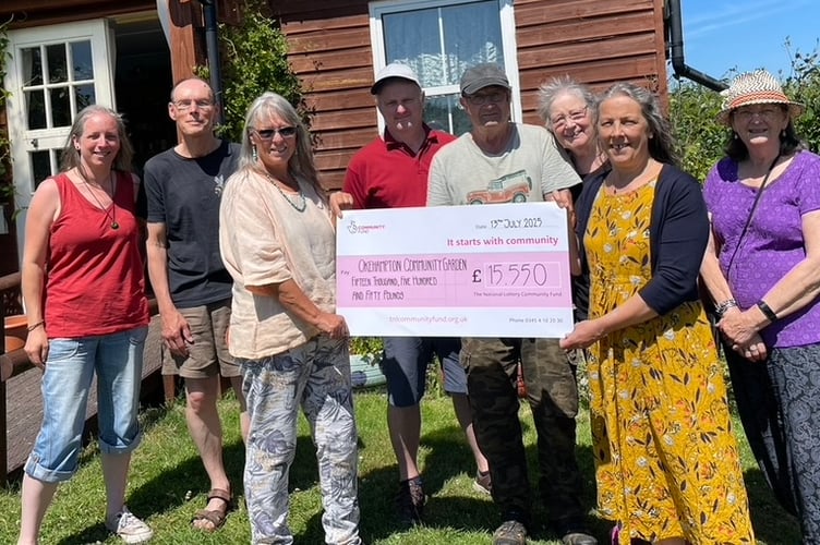 The Community Garden members holding the cheque.
