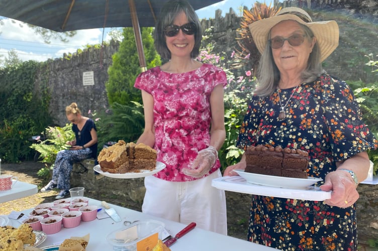 Staff Fran Xx and Carol Tor at Drake Lodge shared accommodation in Tavistock, where they served cakes made by residents, families, volunteers and staff at the home's summer fair.