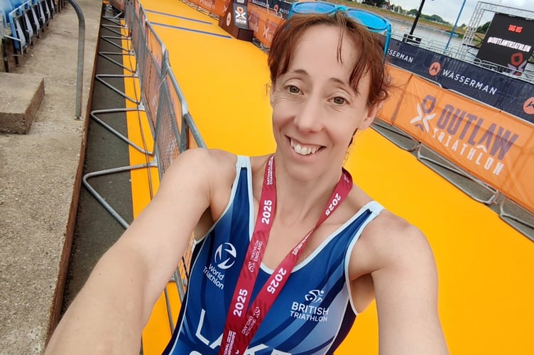 Tavistock Swimming Club's Sam Lake at the finishing line of the National Triathlon Championships where she won an age group medal.