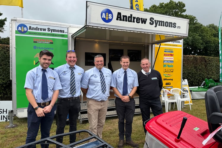 Staff on the Andrew Symons stand. AQ 9906