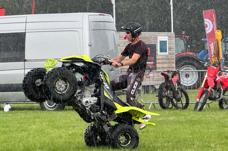 Dangerous Dave did some amazing stunts despite the rain shower during this performance.  AQ 9888
