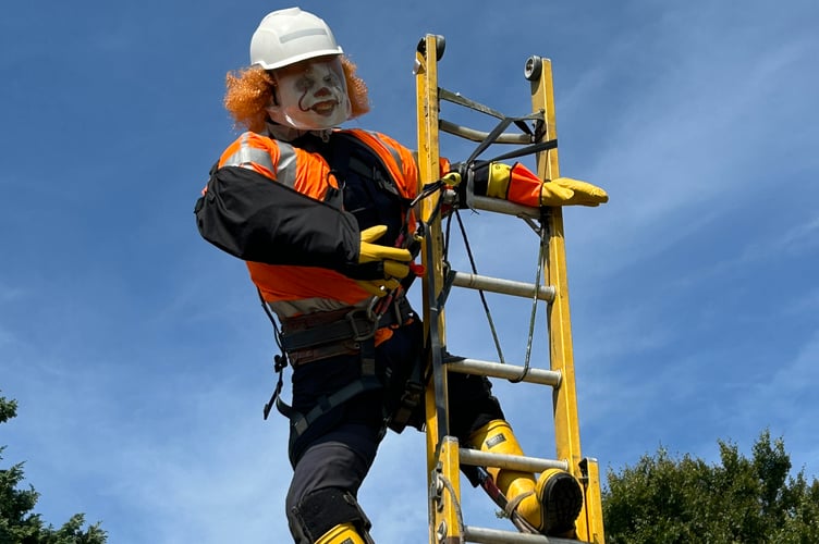 Workman up a ladder - can you spot him?