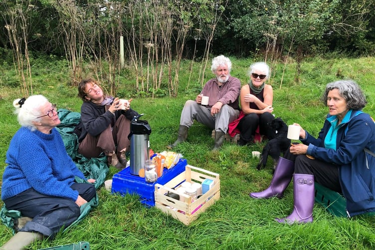 Volunteers take a well earned break with teas, coffees and biscuits after the first glean of apples at an orchard with a return visit scheduled.