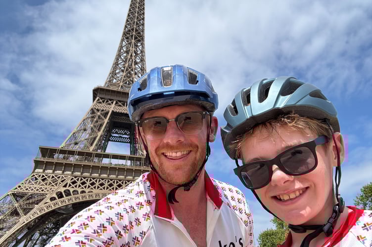 Luke and James Clement, from Horrabridge, at the finish of their epic cycle ride, in front of the Eiffel Tower.