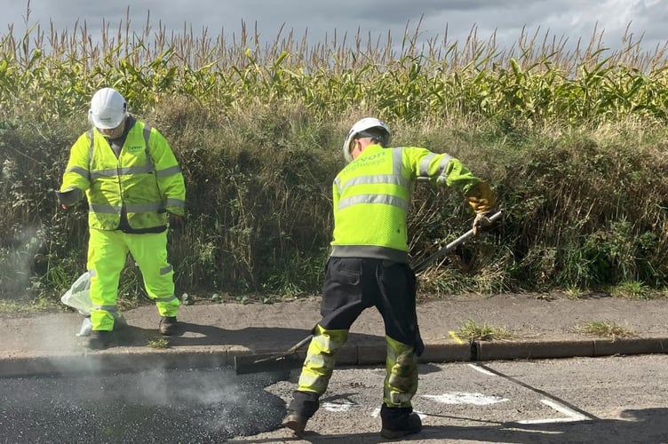 Devon Highways staff repairing a road at North Tawton on Tuesday, September 16.
