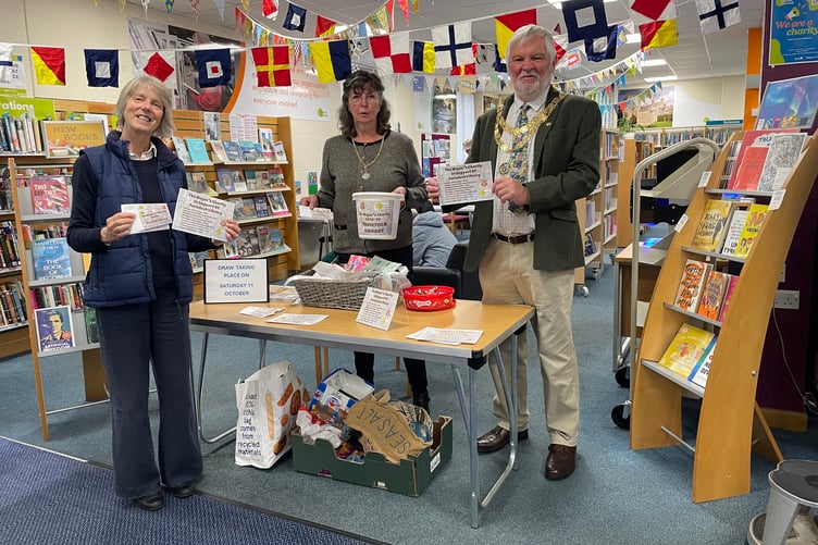 Tavistock Mayor Cllr Steve Hipsey launches his mayoral charity. He is planning to raise funds for Tavistock Library and is pictured with mayoral consort Cathy Hipsey (centre) and librarian Jan Horrell.
