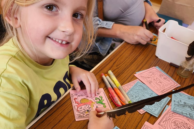 A young girl learning about Tavistock's history through art and play.