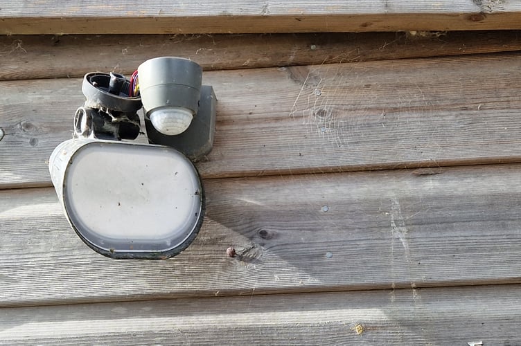 Vandals struck at Tavistock Sensory Garden, scattering damaging the shed which houses the kitchen and store and throwing items around the inside. Pictured is the outside light sensor broken by intruders.