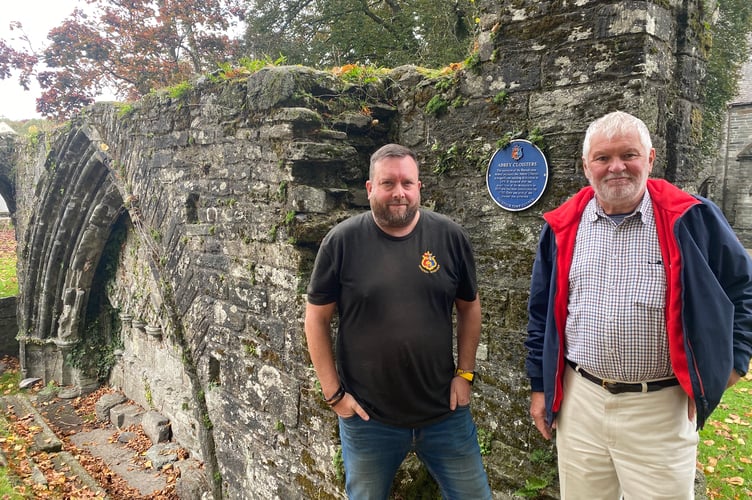 Wayne Southall (left) (Tavistock Town Council general manager), and town Mayor Cllr Steve Hipsey at the former Tavistock Abbey Cloisters remains. They are celebrating the awarding of a grant to investigate Betsy Grimbal's Tower as part of a bigger project to unveil the secrets of the former abbey.