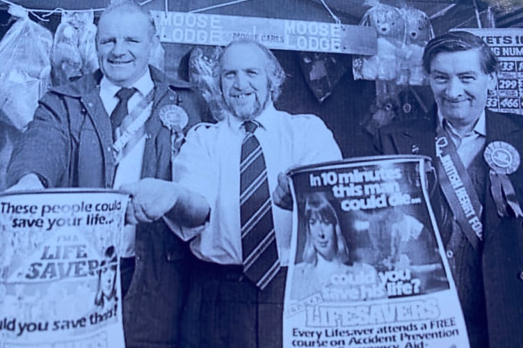 The late Stuart Cole, centre, supporting a community life-saving campaign after surviving accidents himself.