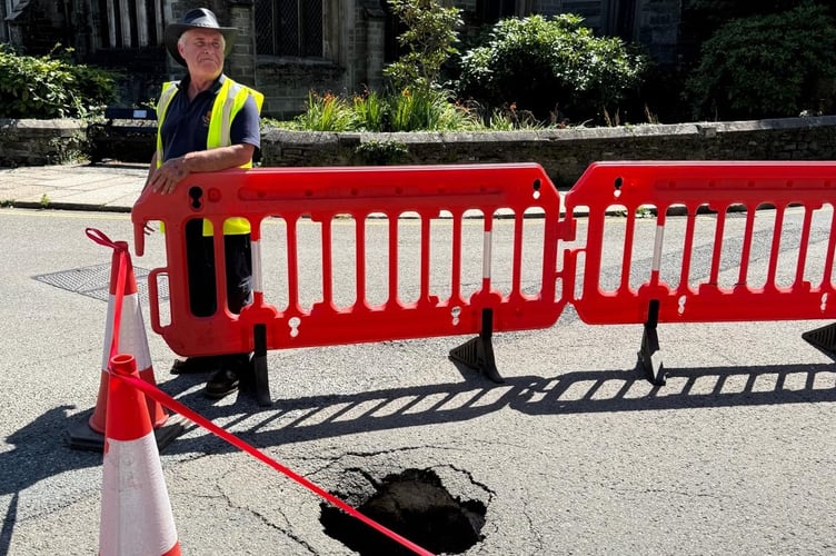 Ian Lashbrook (pictured at a sink hole in Tavistock), veteran Tavistock Town Council works employee, has retired after 46 years with the authority.