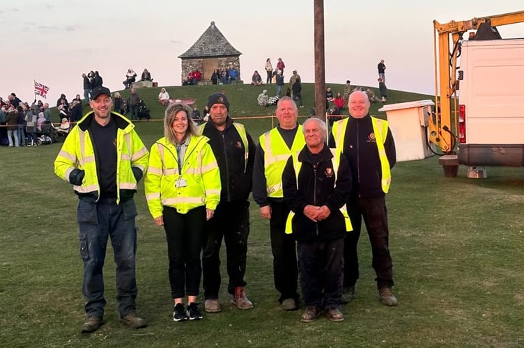 Ian Lashbrook (second from right) has recently retired after 46 years working for Tavistock Town Council. He is pictured with colleagues where he was the expert on the cherrypicker putting up street decorations or lighting the beacon on the pictured Pimple landmark..