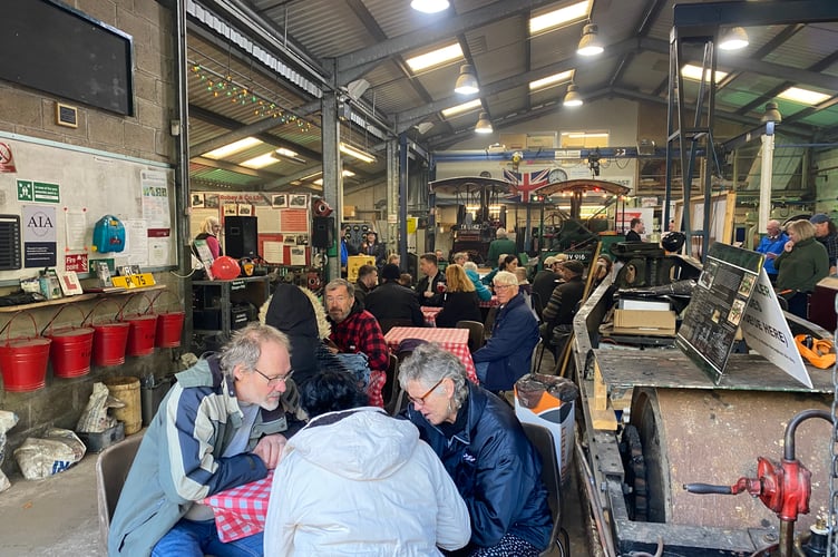 Visitors enjoying a sitdown in the engine shed and workshops at the Robey Trust Sausage and Steam Fair in Tavistock.