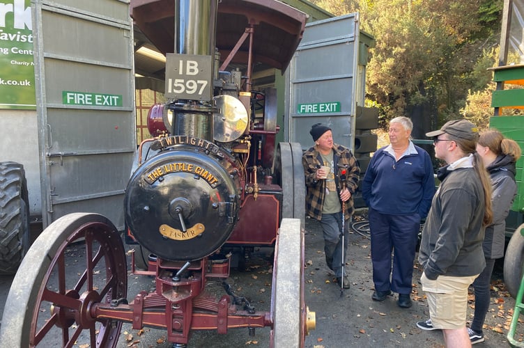 Steam engine fans chatting over the hot topics at the Robey Trust Sausage and Steam Fair in Tavistock.