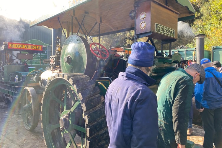 Having a close look are steam engine fans at the Robey Trust Sausage and Steam Fair in Tavistock.