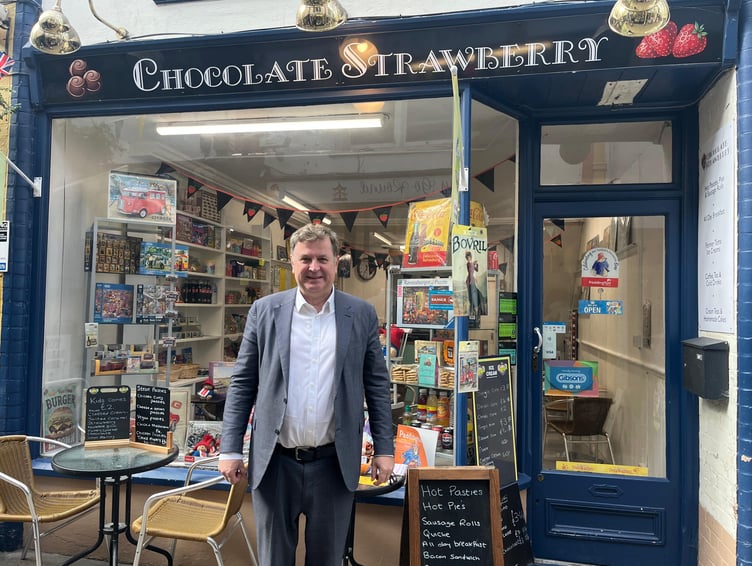 Okehampton MP Mel Stride outside 'Chocolate Strawberry' in the Okehampton Arcade.
