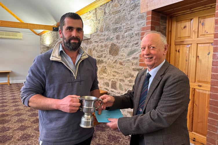 Sam Reed won the Devon County Ploughing Association Reversible trophy, presented by President Raymond Govier. AQ 7134