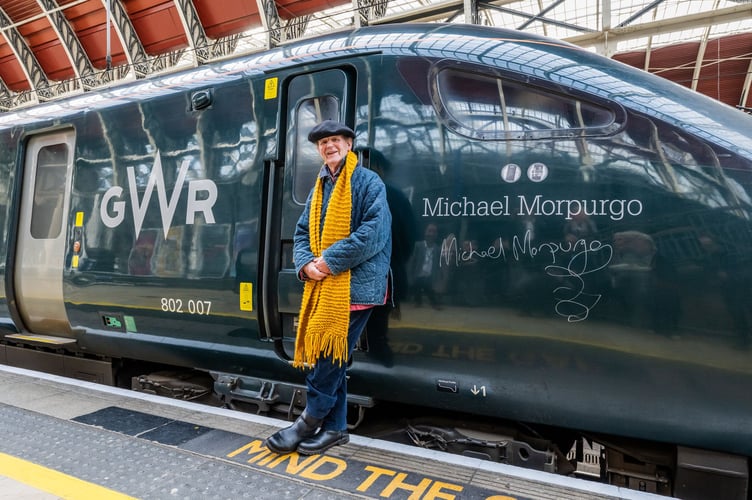 Michael Morpurgo pictured standing next to the new livery.