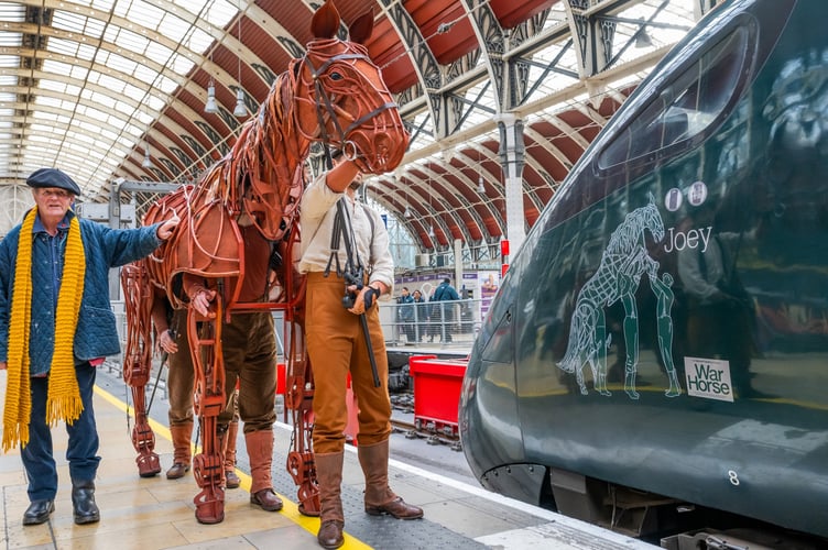 Michael Morpurgo alongside the puppet Joey.