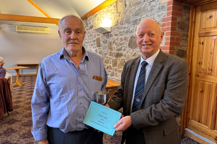 Bill Tonkin won the Devon County Ploughing Association Semi-Digger trophy, presented by President Raymond Govier. AQ 7121