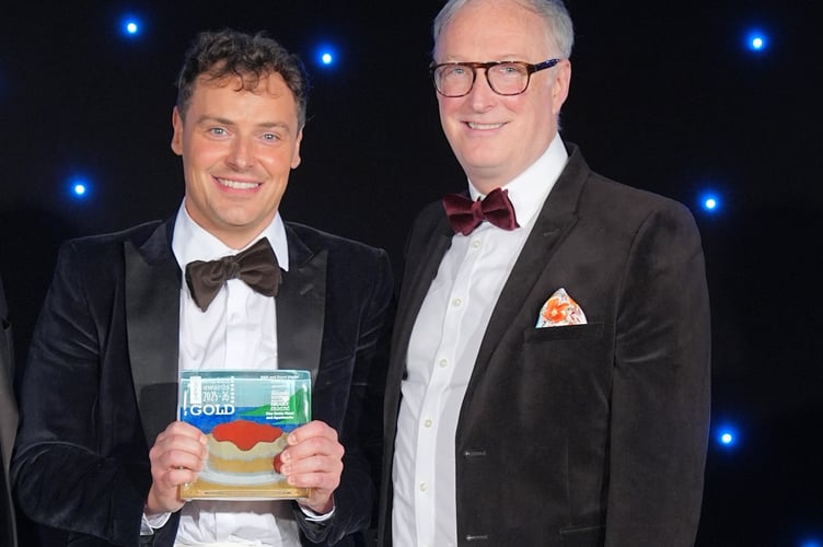 Jack and Iain White Duncan of One Drake Road collecting their award.