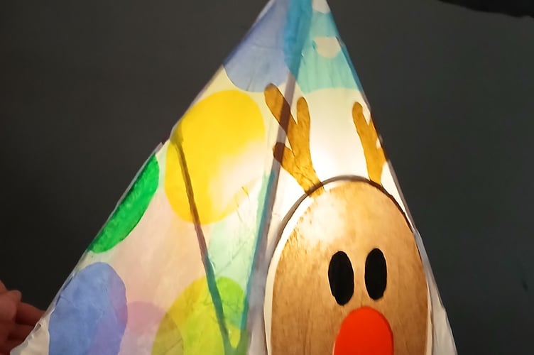 A seasonal reindeer lantern made at workshops for the Tavistock Dickensian Evening parade. The sessions were held by West Devon Community Art Workshops.