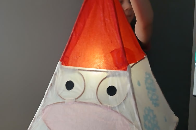 A smiling Santa lantern made at workshops for the Tavistock Dickensian Evening parade. The sessions were held by West Devon Community Art Workshops.