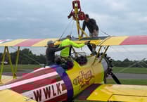 Father and son raise funds for Hatherleigh band with daring wing-walk