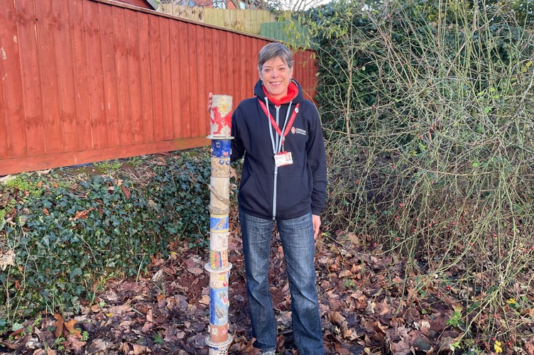 Cath Kelly with the totem pole in Peoples Park