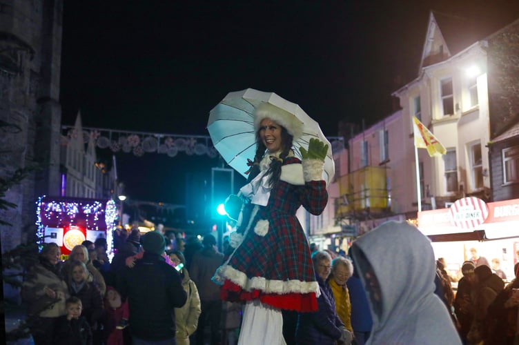 A stilt walker gets a good view over the crowd at Edwardian Evening in Okehampton.