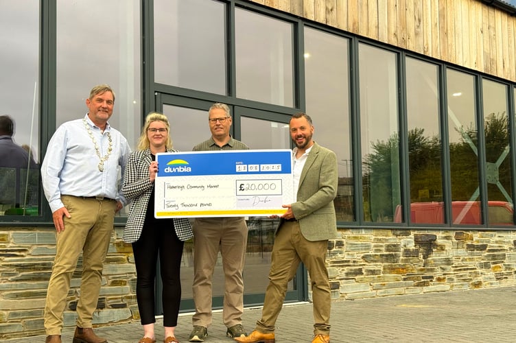 With the donation towards Hatherleigh Market, are, from left, Hatherleigh Mayor and chair of Hatherleigh Town Council Cllr Mark Reddaway, Dunbia West Devon site manager Sarah Mahon, West Devon borough councillor for Hatherleigh Patrick Kimber and Cllr Richard Burrow, Hatherleigh town councillor and chair of Hatherleigh Community Market
