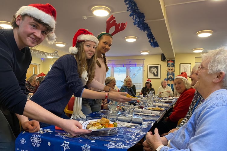 Tavistock Area Support Services treat their users to a festive lunch served by Mount Kelly College students.