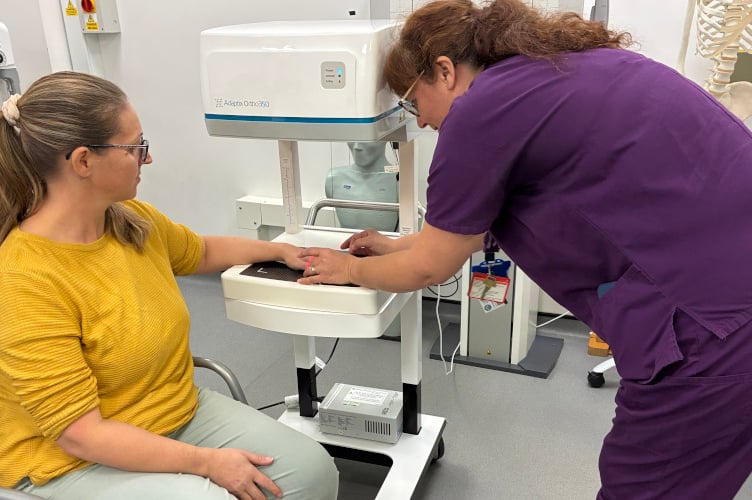 Emma Carnell undergoing her scan with Professor Karen Knapp.
