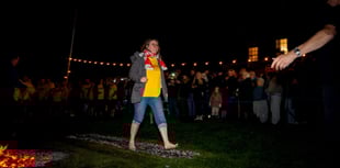 Specsavers employee raises £600 for Hospiscare in charity firewalk