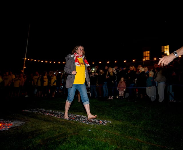 Specsavers employee raises £600 for Hospiscare in charity firewalk