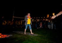 Okehampton Specsavers employee raises £600 for Hospiscare in charity firewalk