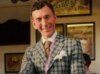 One of two men missing from a Christmas Day swim has been named