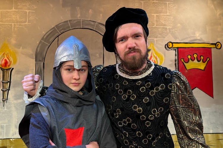 Lewis Dyson, right, plays the part of the Sheriff and is pictured with guard Caitlin Bradley (13).  AQ 1670
