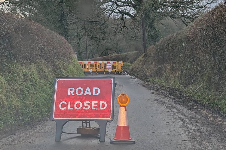 The road was closed suddenly to repair a mains leak.